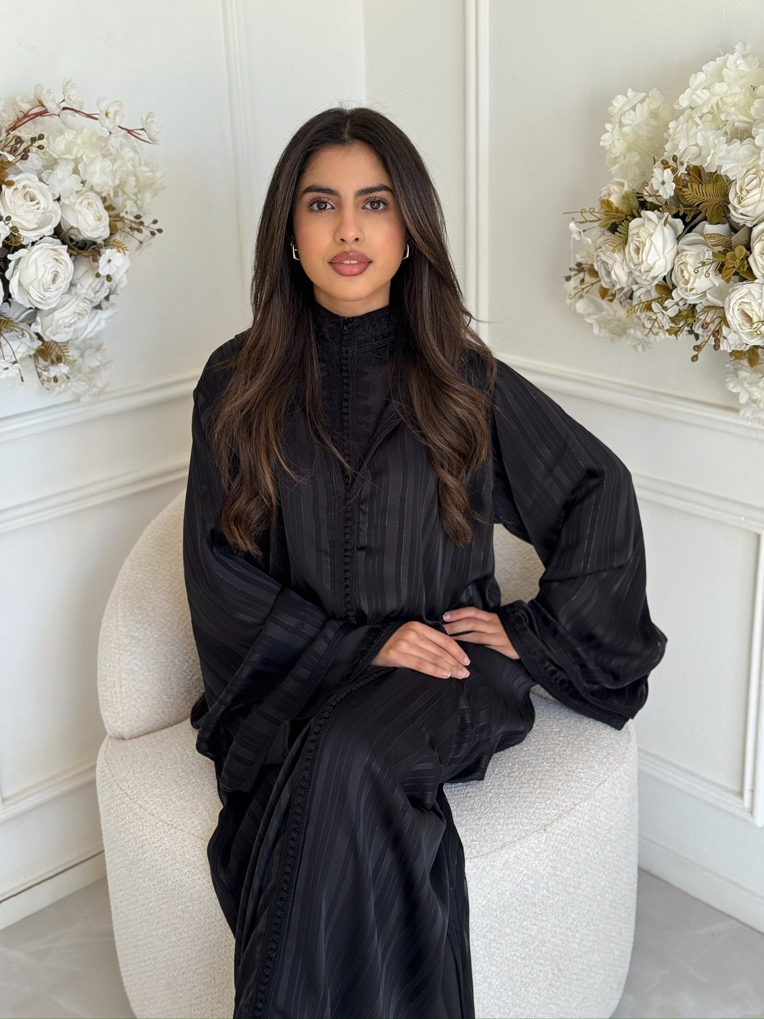 Woman wearing the Jellaba Yakouta, a luxury handmade Moroccan jellaba with an elegant flowing fit.