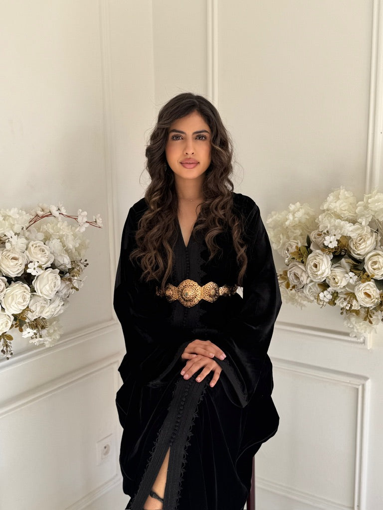 Model wearing Caftan Nouzha – black velvet Moroccan caftan with tonal embroidery