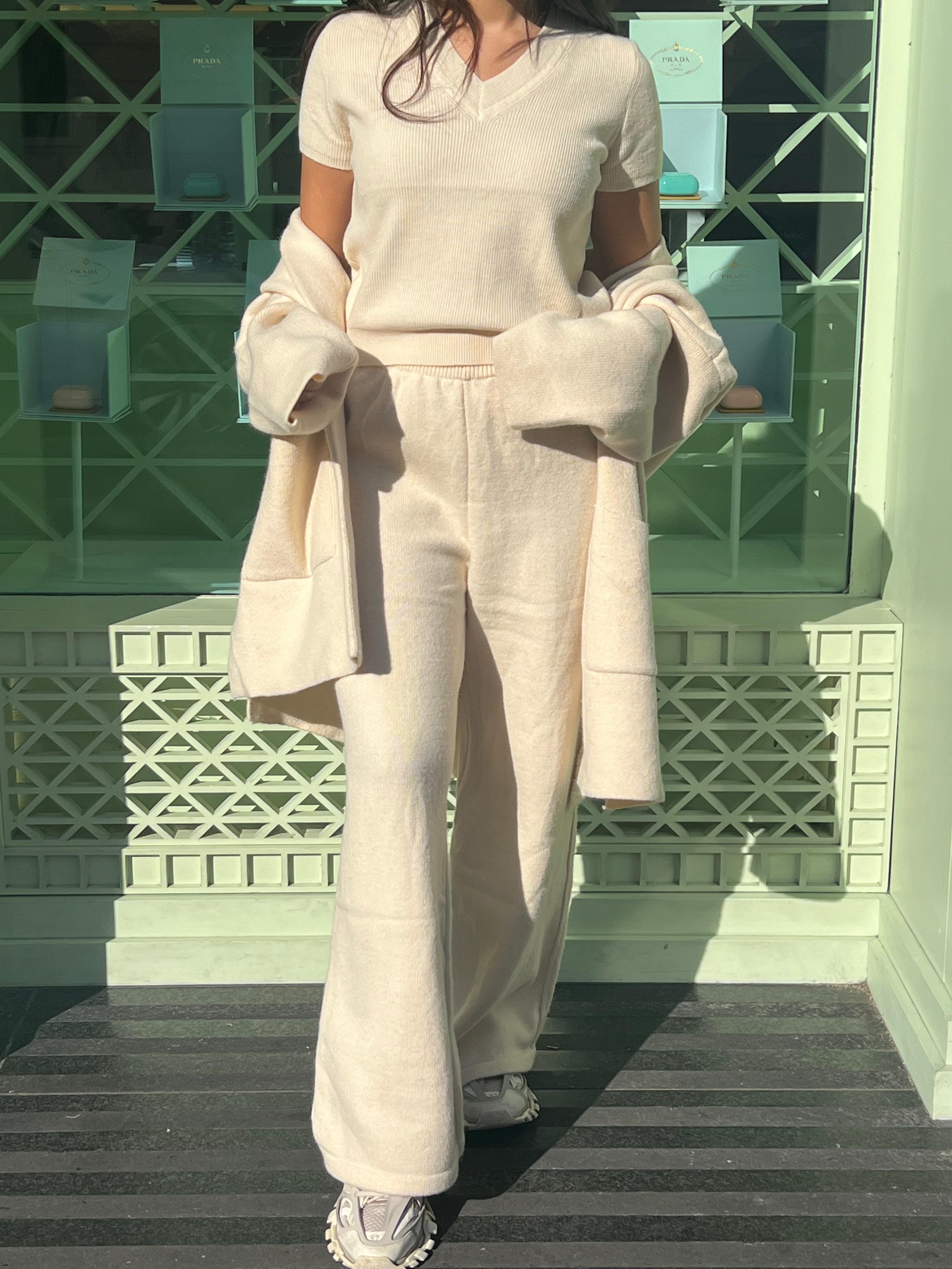 Elegant beige Alaia three piece knit outfit featuring soft fabric and relaxed fit