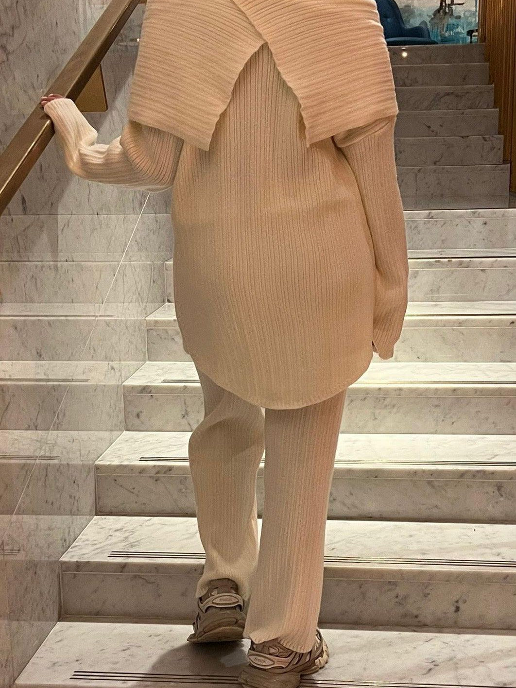 Woman wearing Mira knit two piece set with ribbed top and straight-leg pants from the back