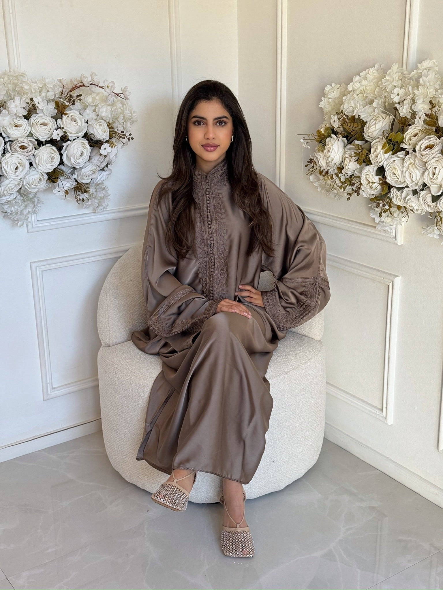 Woman wearing the Gandoura Zahra, a luxury handmade Moroccan gandoura with a soft flowing fit.