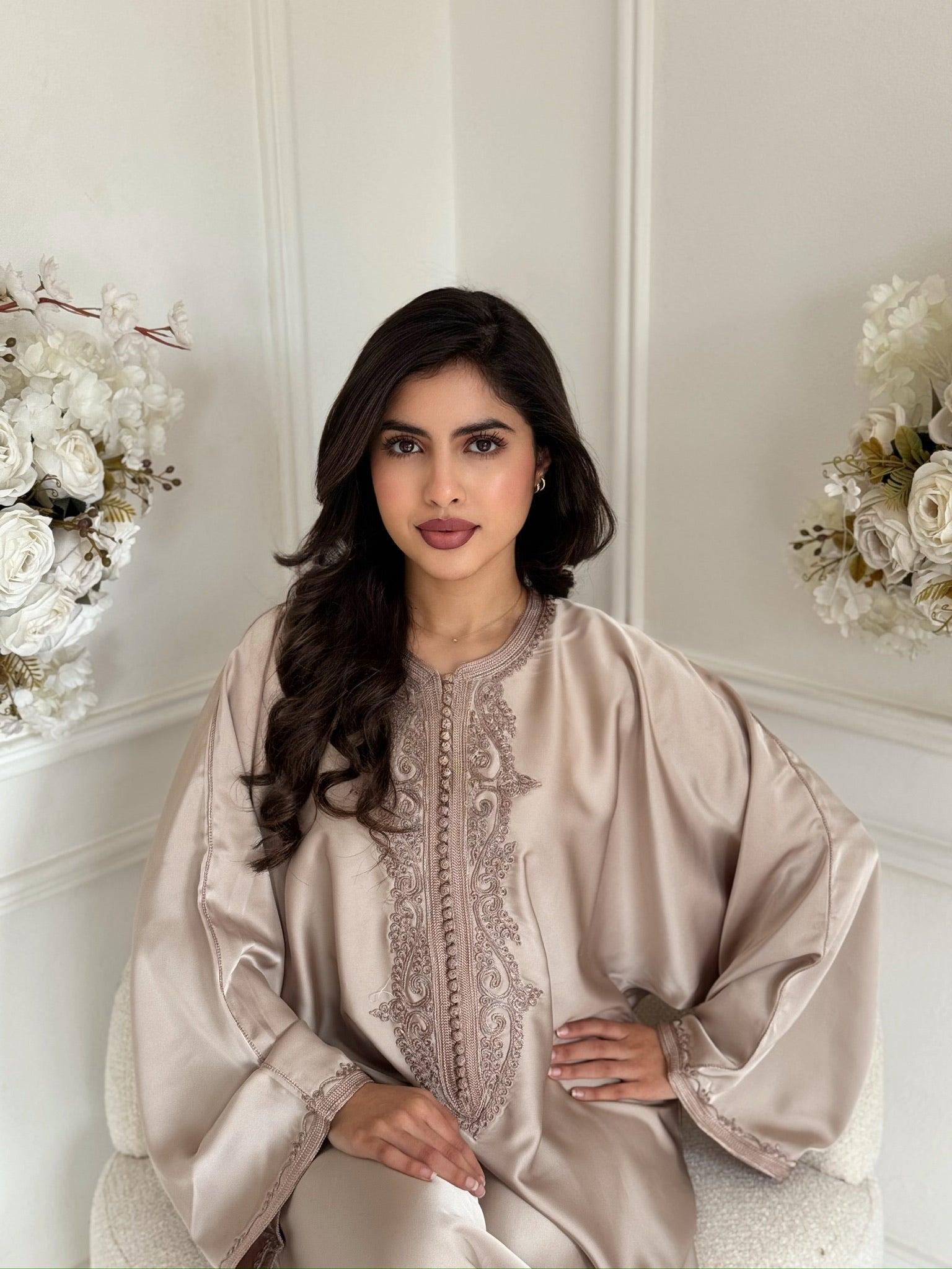 “Model wearing beige Gandoura Ayana, elegant lightweight Ramadan and Eid dress with embroidery”