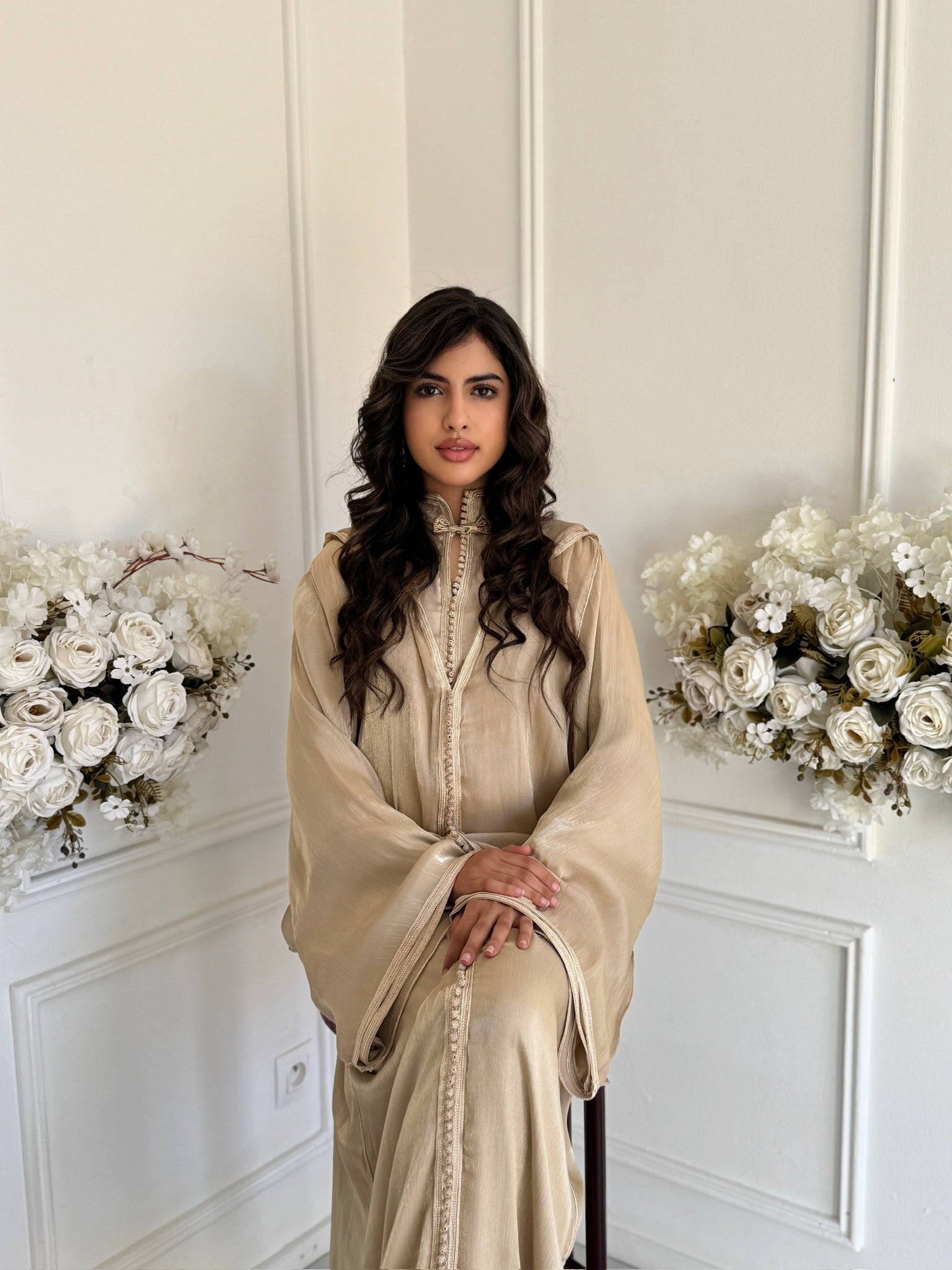 Model wearing Jellaba Dahiba – gold Moroccan jellaba with elegant embroidery