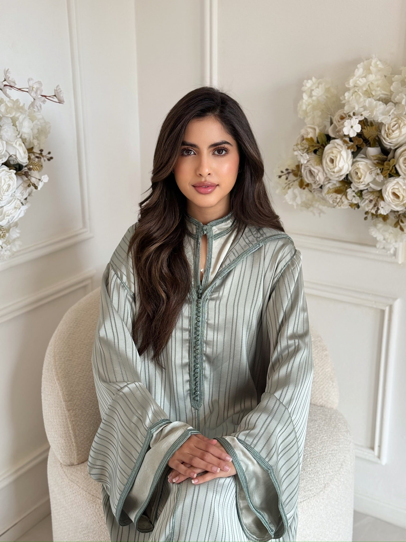 Woman wearing the Jellaba Sahar, an elegant Moroccan jellaba with wide sleeves, modest dress for Eid and special occasions.
